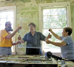 Bob Yapp holding window glass.