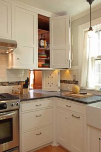 Use photo of close-up of kitchen corner with pass-through door above countertop.