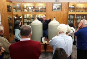 People and state fair jugs.