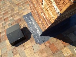 Photo of sealant at chimney base.