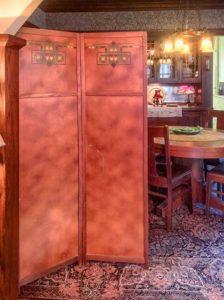 Folding screen in dining room.