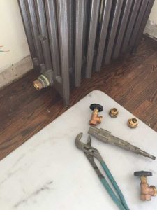 A refurbished radiator is ready to be hooked up to the hot water heating system.