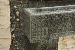 Close-up of the new box covered in wire.