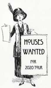 Woman with 'Houses Wanted' sign.